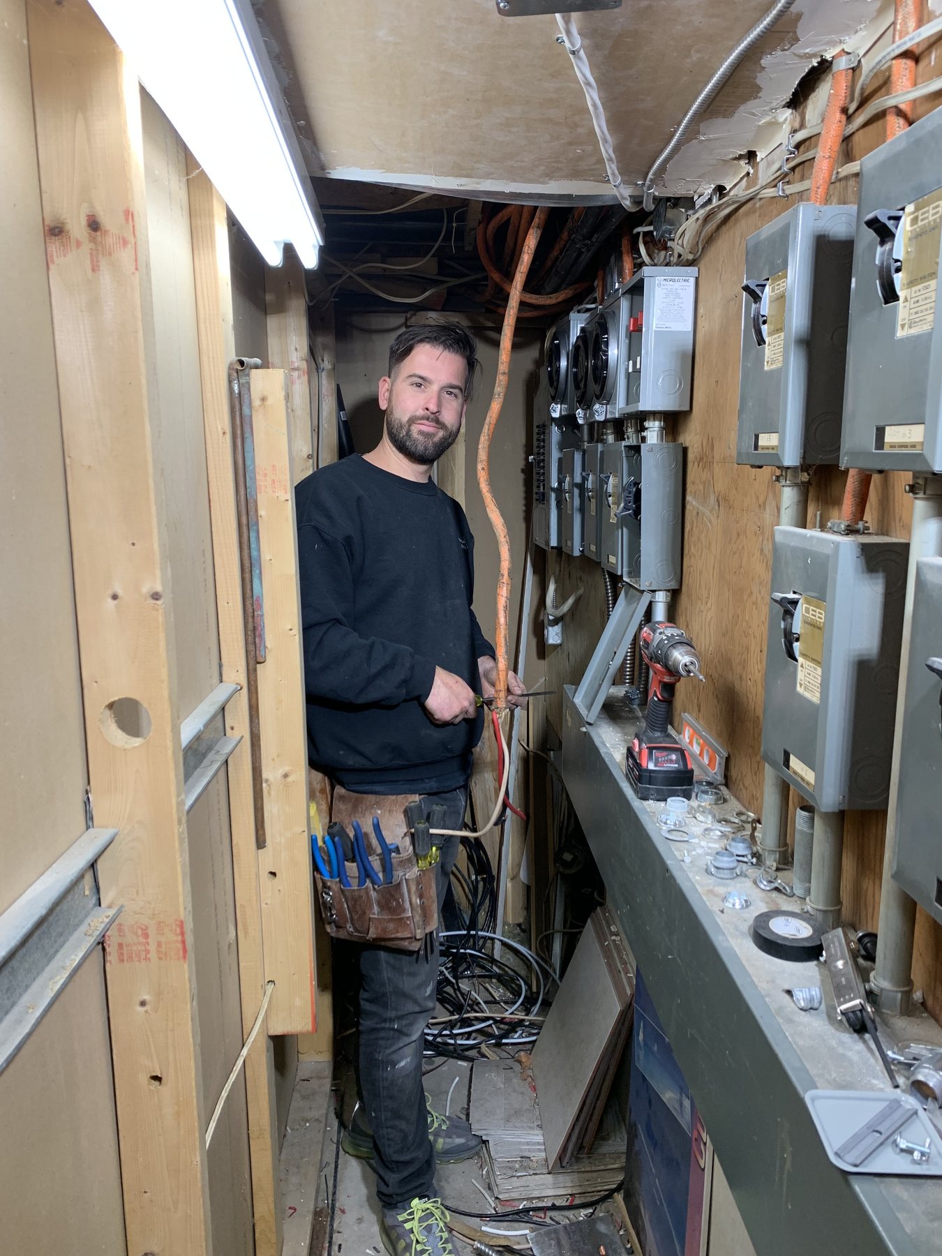 Croatian Electric technician working in a meter room